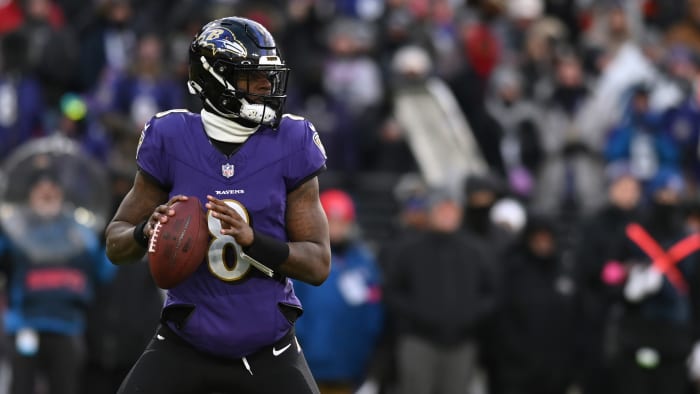 Lamar Jackson stands in the pocket